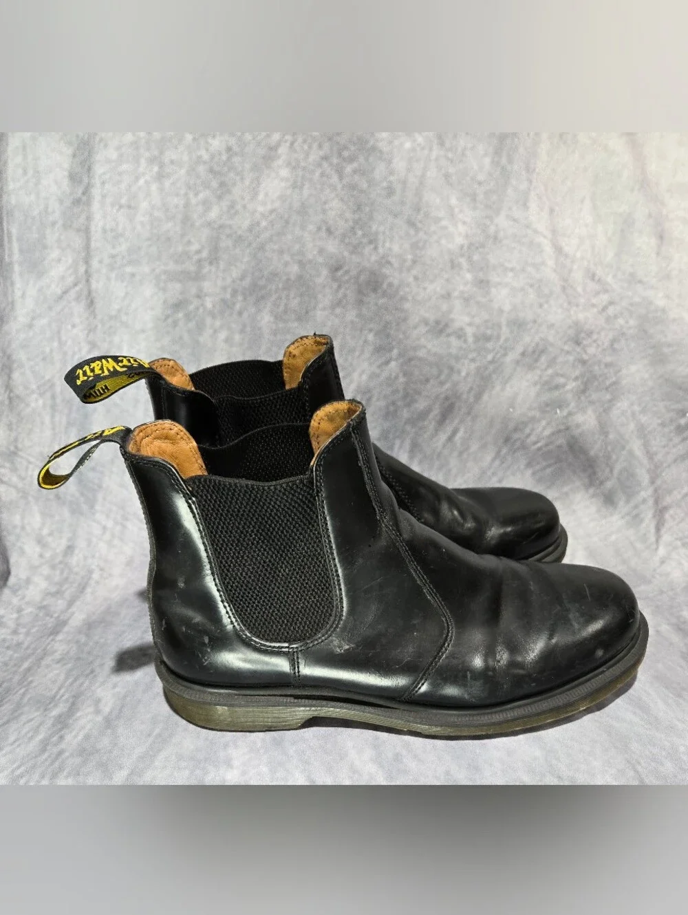 These boots are the iconic Dr. Martens 2976 Chelsea Boots